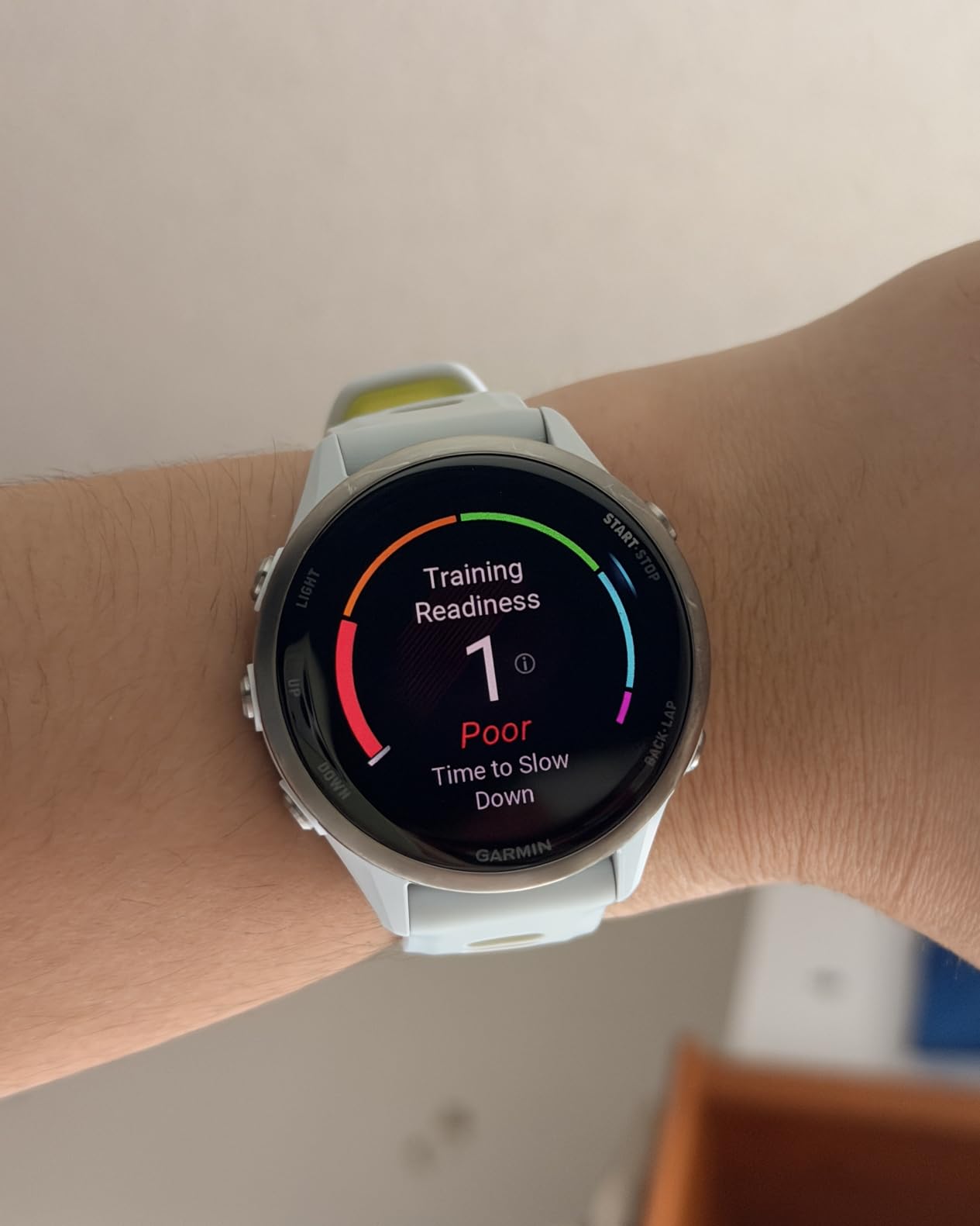 Forerunner® 970, Premium GPS Running and Triathlon Smartwatch, AMOLED Display, Built-in LED Flashlight, Soft Gold Titanium with French Gray Case and French Gray/Translucent Indigo Band customer photo 1