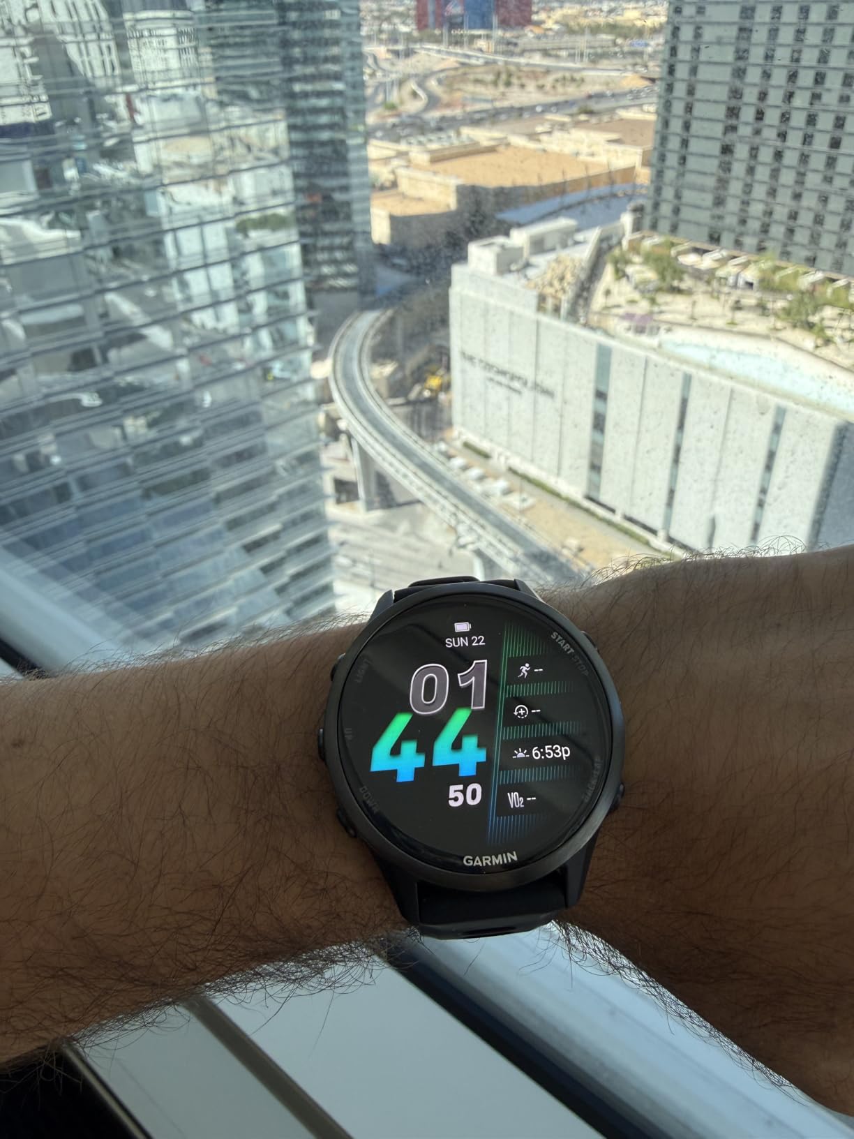 Forerunner® 970, Premium GPS Running and Triathlon Smartwatch, AMOLED Display, Built-in LED Flashlight, Soft Gold Titanium with French Gray Case and French Gray/Translucent Indigo Band customer photo 2