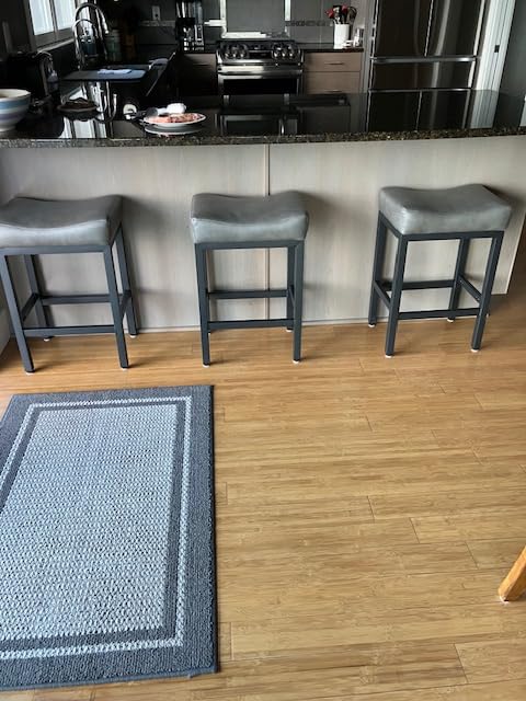 Raynesys Counter Height Bar Stools Set of 2, 24 Inch Barstools for Kitchen Island Counter, Bonded Leather Kitchen Stools with Thick Saddle Seats & Heavy Duty Metal Base, Easy Assembly, All Black customer photo 1
