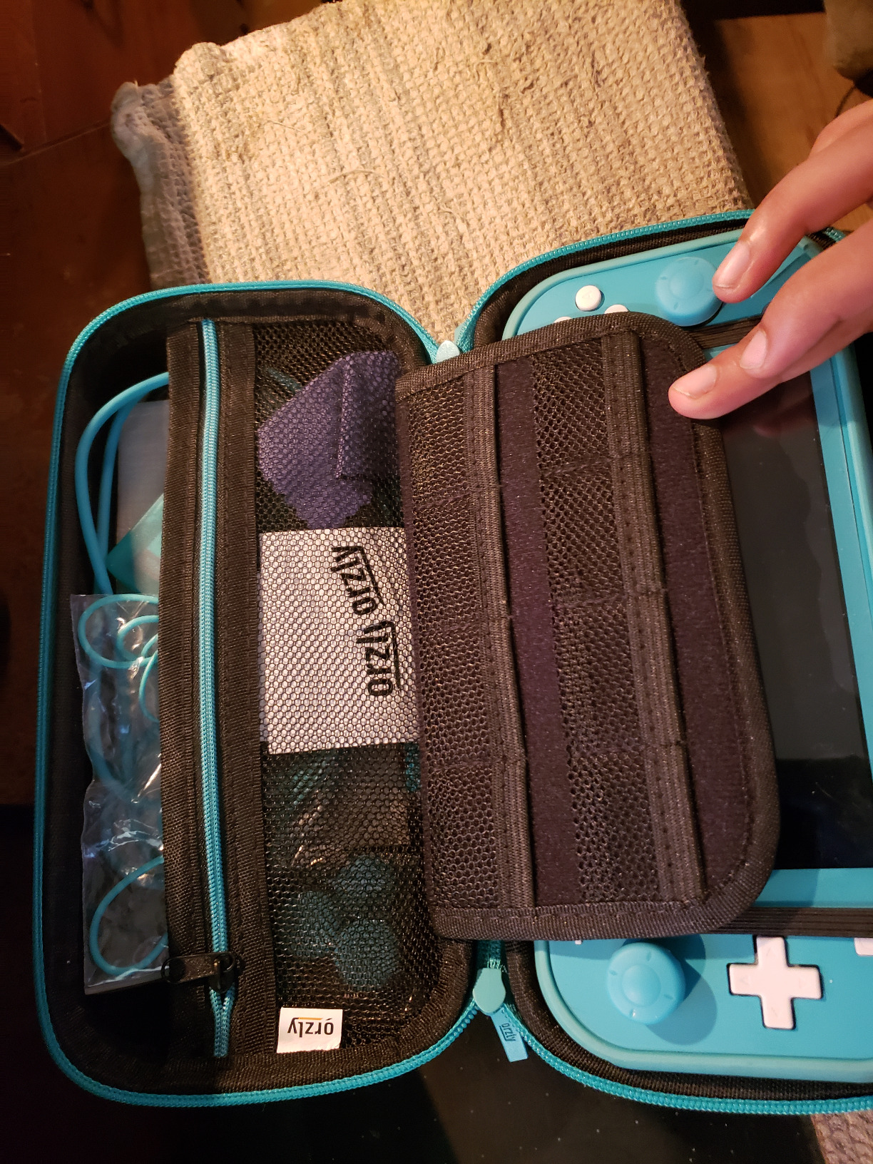 Orzly Switch Lite Accessories Bundle - Case & Screen Protector for Nintendo Switch Lite Console, USB Cable, Games Holder, Grip Case, Headphones, Thumb-Grip Pack & More (Gift Pack - Turquoise Blue) customer photo 1