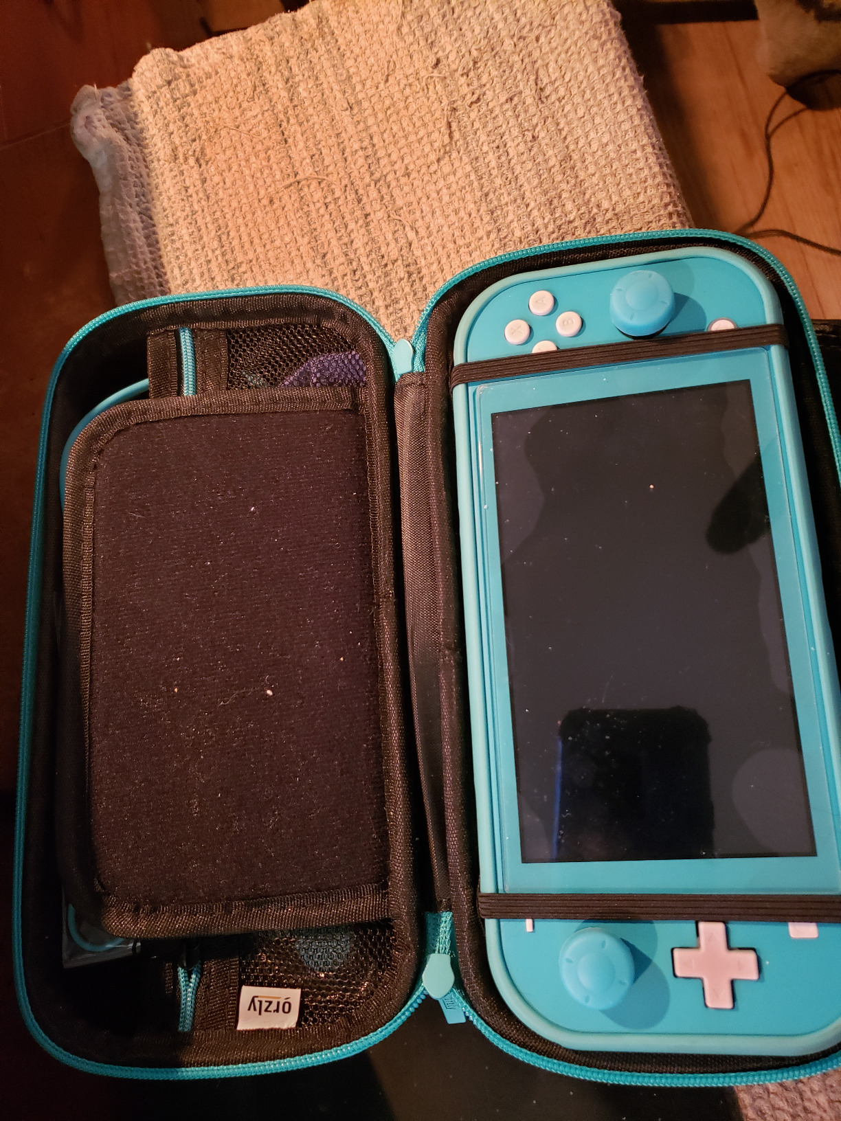 Orzly Switch Lite Accessories Bundle - Case & Screen Protector for Nintendo Switch Lite Console, USB Cable, Games Holder, Grip Case, Headphones, Thumb-Grip Pack & More (Gift Pack - Turquoise Blue) customer photo 2
